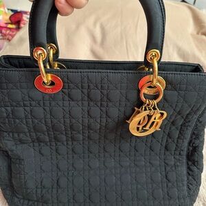 Christian Dior cloth black bag with gold charms with logo